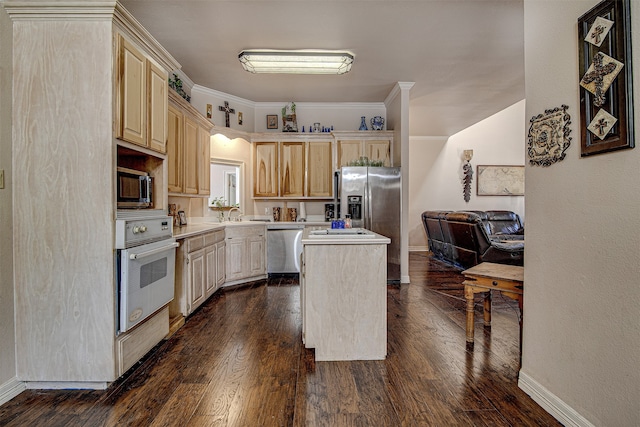 kitchen featuring ornamental molding, stainless steel appliances, light brown cabinets, a center island, and dark hardwood / wood-style floors