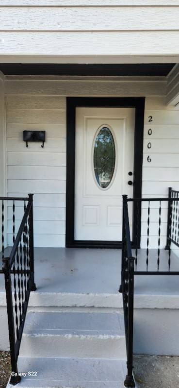 doorway to property featuring covered porch