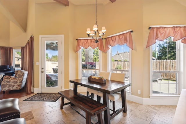 dining room featuring beam ceiling, high vaulted ceiling, and an inviting chandelier