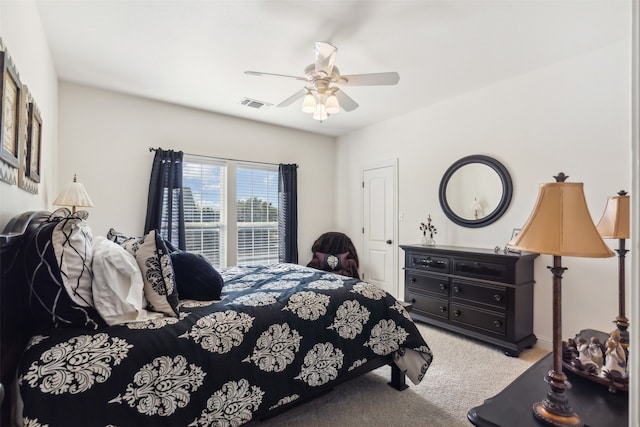 bedroom featuring light colored carpet and ceiling fan