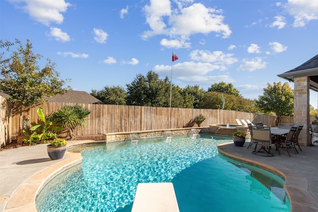 view of swimming pool featuring a patio area