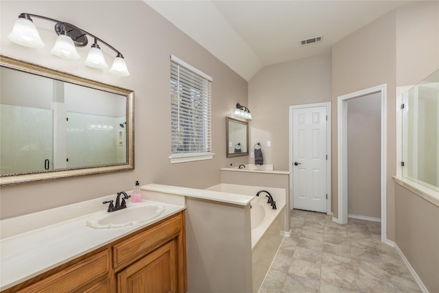 bathroom featuring tile patterned flooring, vanity, independent shower and bath, and vaulted ceiling