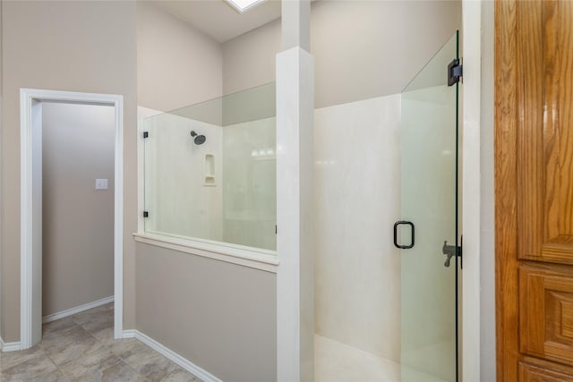 bathroom with tile patterned floors and a shower with shower door