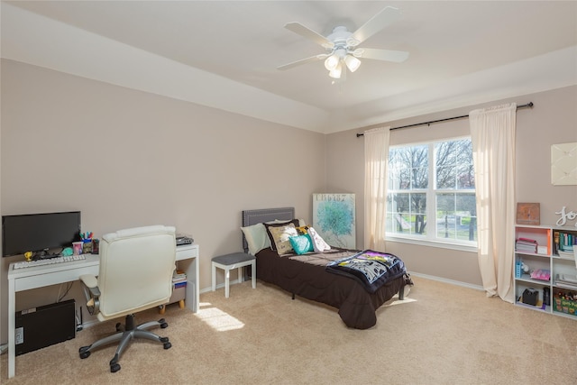 bedroom with light carpet and ceiling fan