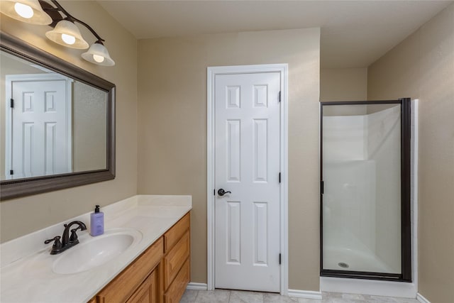 bathroom featuring tile patterned flooring, vanity, and an enclosed shower