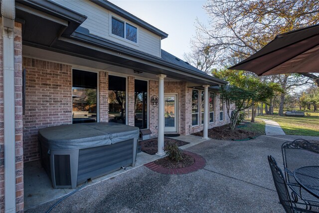 view of patio featuring a hot tub