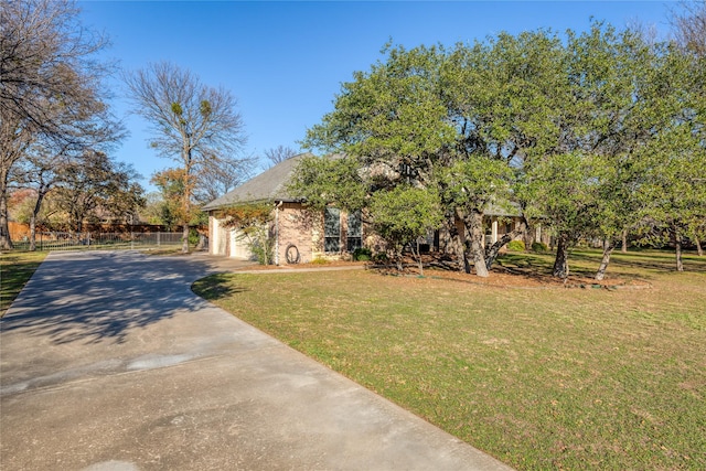 view of front of home with a garage and a front yard