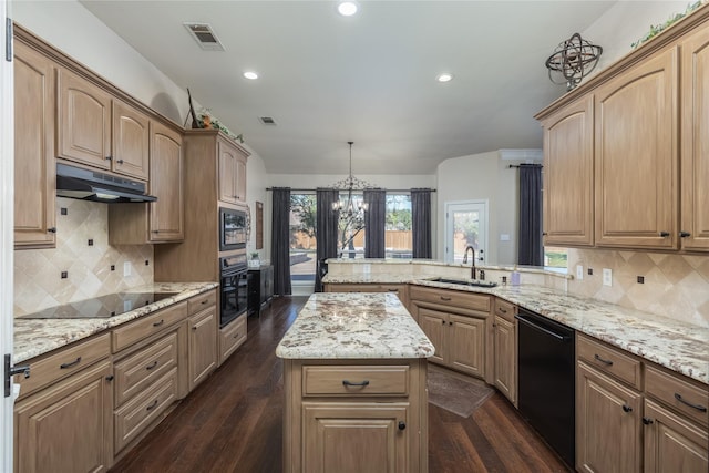 kitchen featuring tasteful backsplash, dark wood-type flooring, sink, black appliances, and hanging light fixtures