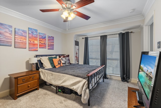 carpeted bedroom with ceiling fan and crown molding