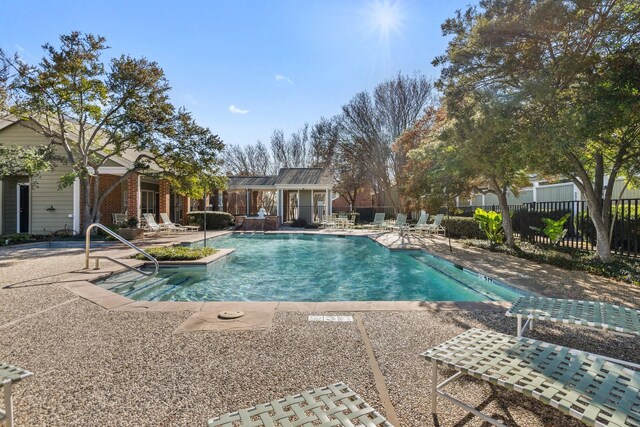 view of pool featuring a patio area