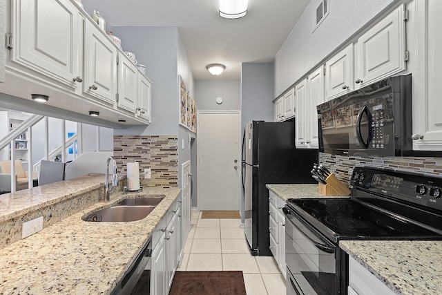 kitchen with white cabinets, sink, backsplash, and black appliances