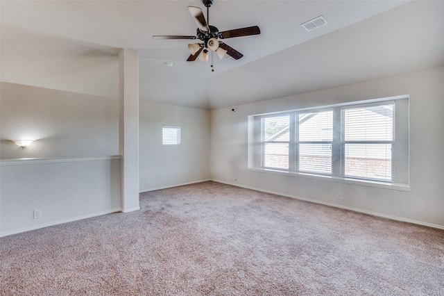 empty room with light carpet, ceiling fan, and lofted ceiling