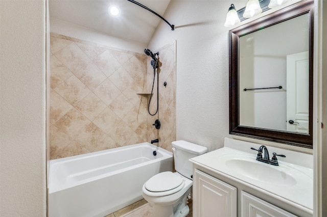 full bathroom featuring vanity, toilet, lofted ceiling, and tiled shower / bath combo