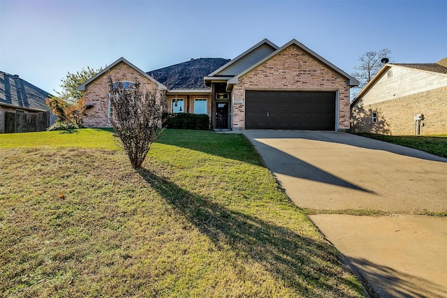 view of front facade featuring a garage and a front lawn