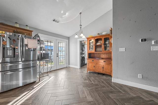 kitchen featuring dark parquet flooring, french doors, stainless steel fridge with ice dispenser, decorative light fixtures, and lofted ceiling