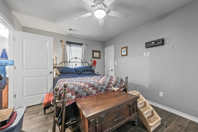 bedroom featuring dark hardwood / wood-style flooring and ceiling fan