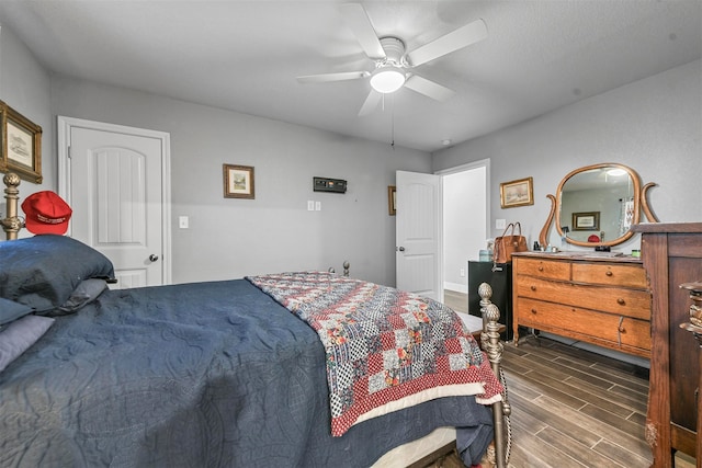 bedroom featuring dark hardwood / wood-style floors and ceiling fan