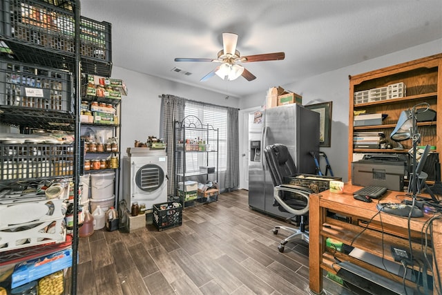 office area with washer / dryer, a textured ceiling, ceiling fan, and wood-type flooring