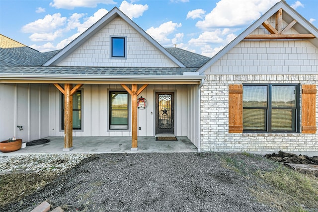 doorway to property with covered porch