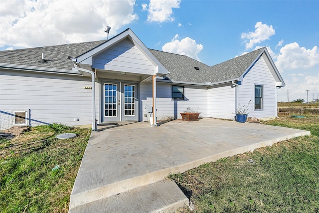 view of front of property with a patio area and french doors