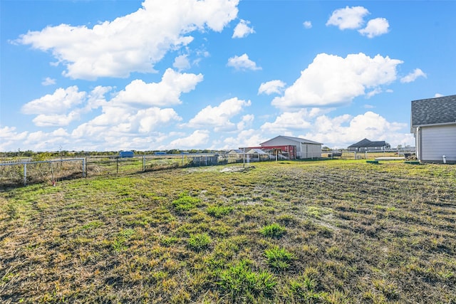 view of yard with a rural view