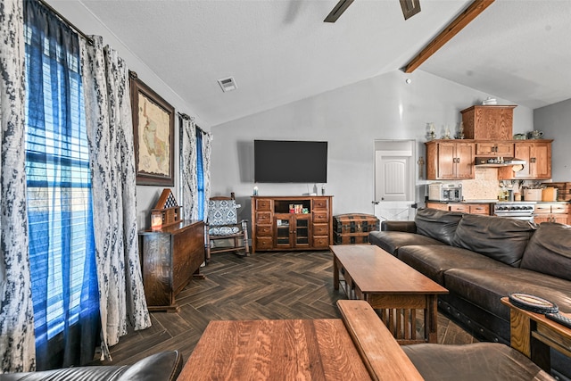 living room featuring vaulted ceiling with beams, dark parquet floors, ceiling fan, and a textured ceiling