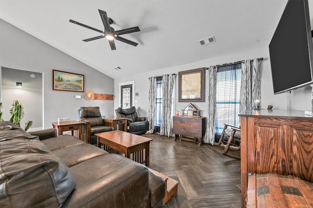 living room with ceiling fan, dark parquet flooring, and lofted ceiling