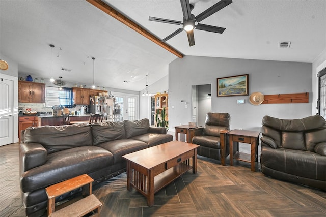 living room featuring a textured ceiling, vaulted ceiling with beams, ceiling fan, and dark parquet floors