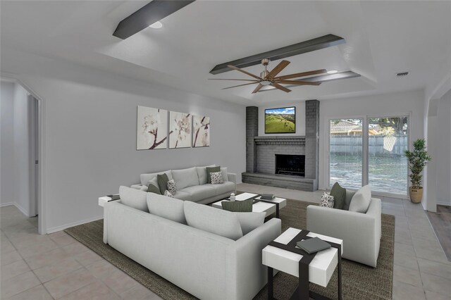 living room with ceiling fan, light tile patterned flooring, and a fireplace