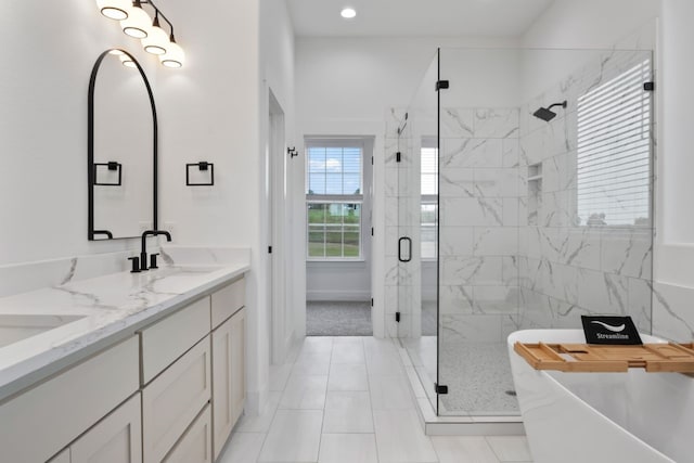 bathroom featuring separate shower and tub, tile patterned flooring, and vanity