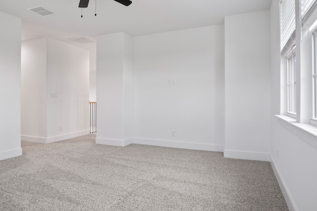 carpeted empty room with ceiling fan