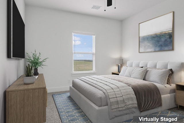 bedroom with dark colored carpet