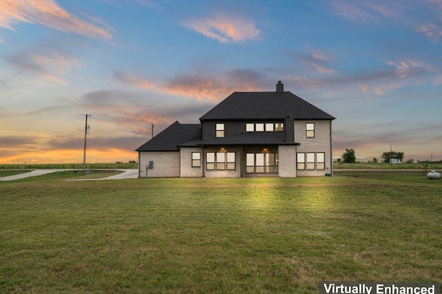 view of front of house with a lawn