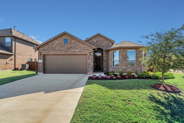 view of front facade featuring central AC, a front lawn, and a garage