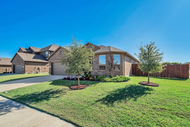 view of front of property with a garage and a front yard