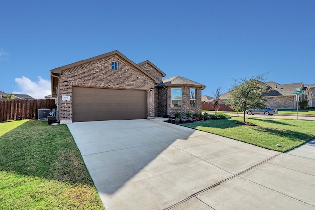 view of front of house featuring a garage and a front yard