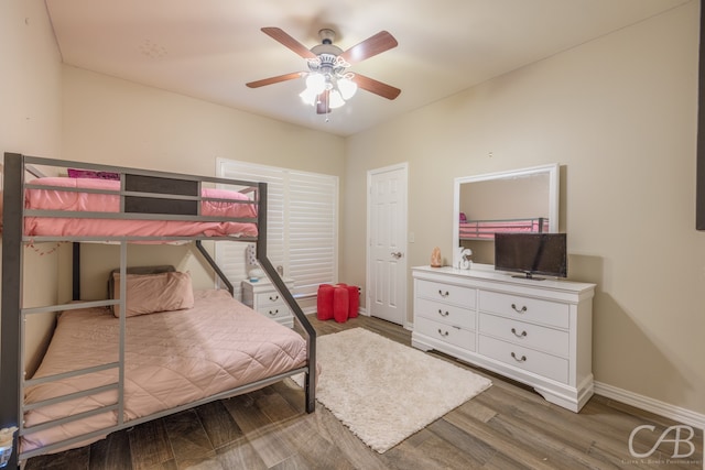 bedroom featuring hardwood / wood-style flooring and ceiling fan