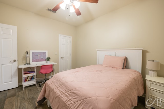 bedroom featuring dark hardwood / wood-style floors and ceiling fan