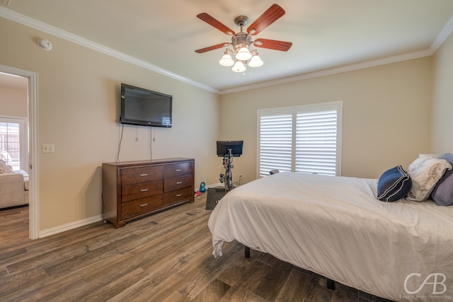 bedroom featuring hardwood / wood-style floors, ceiling fan, ornamental molding, and multiple windows