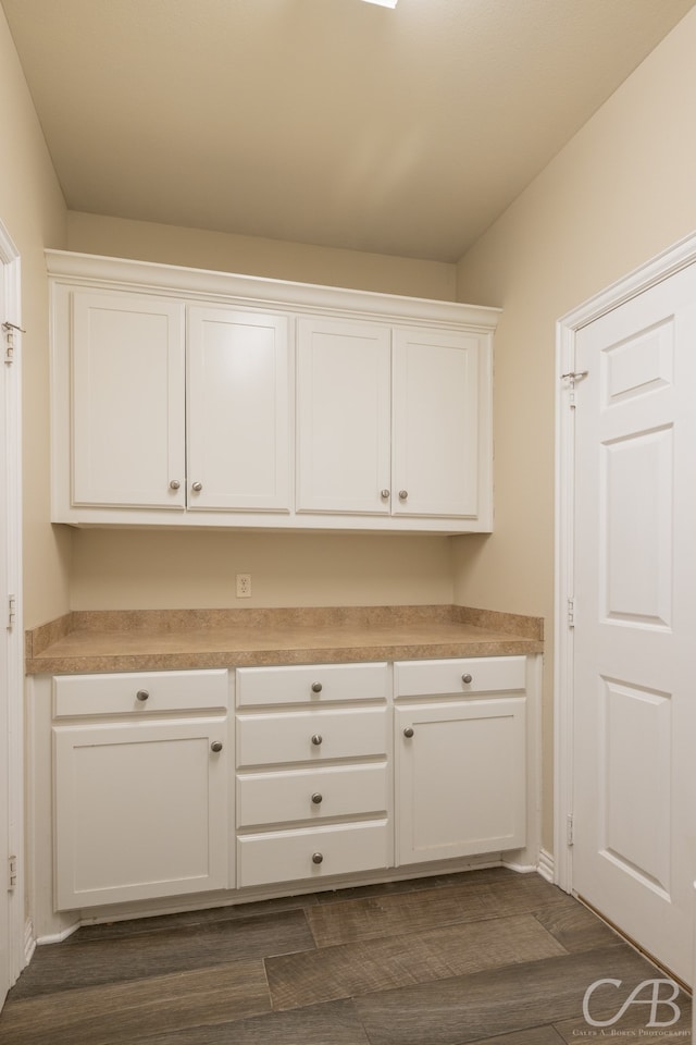 kitchen with white cabinets and dark wood-type flooring