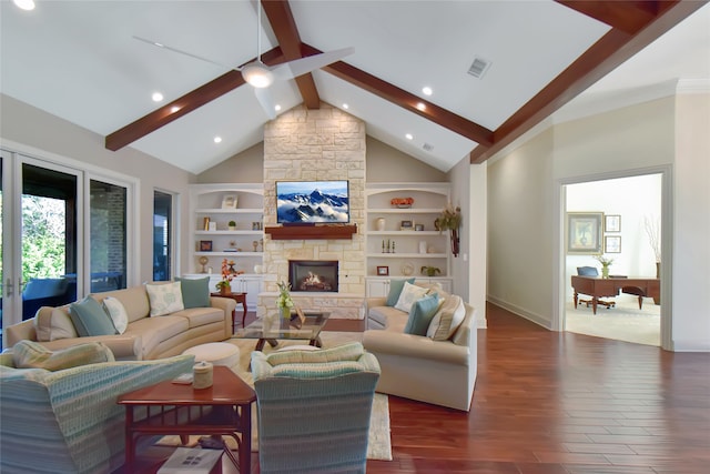 living room with beamed ceiling, built in features, a fireplace, and dark wood-type flooring