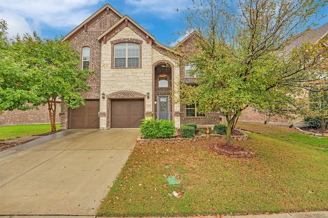 view of front of home featuring a garage and a front lawn