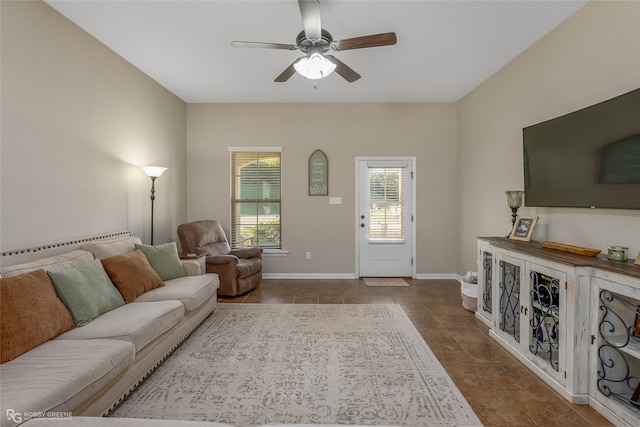 tiled living room with ceiling fan