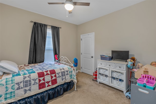 bedroom with ceiling fan and light colored carpet