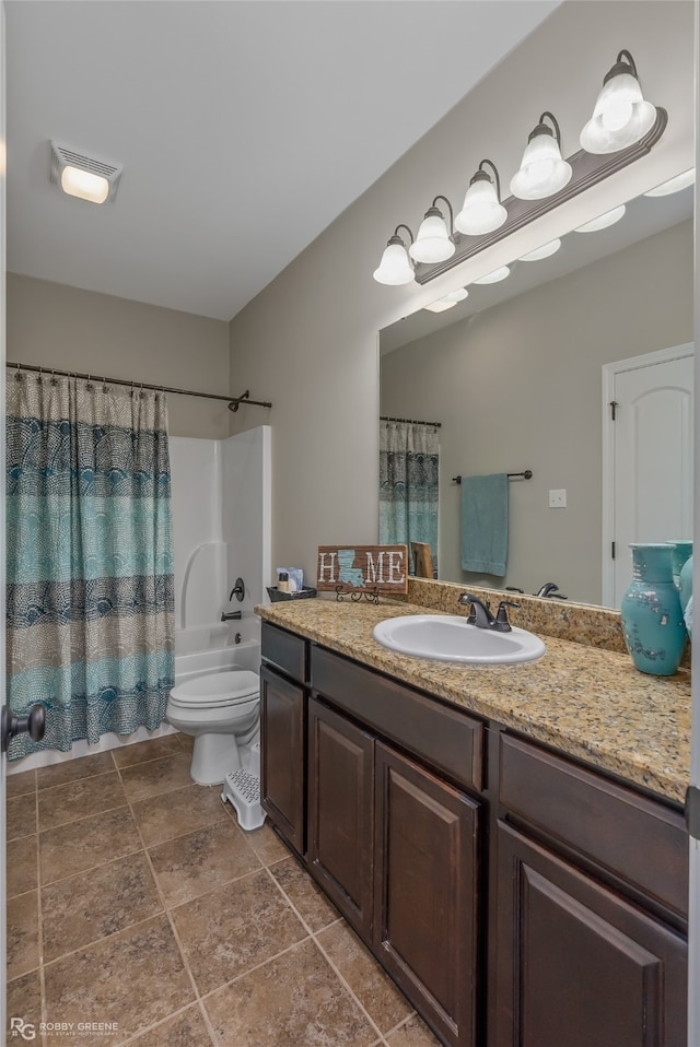 full bathroom featuring shower / bath combo, toilet, and vanity