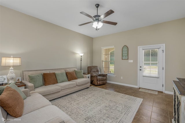 living room featuring tile patterned floors and ceiling fan