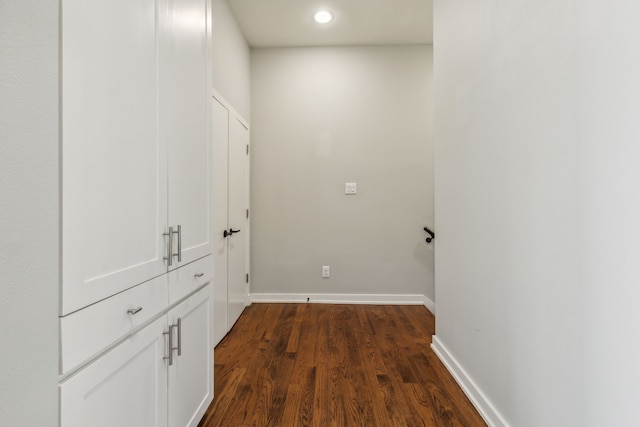 hall with dark hardwood / wood-style floors