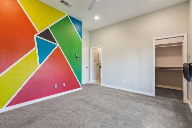 unfurnished bedroom featuring carpet flooring, a closet, and ceiling fan