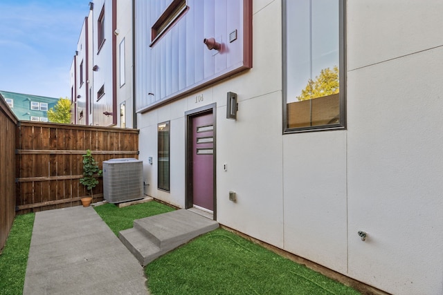 doorway to property featuring cooling unit