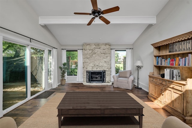 living room with vaulted ceiling with beams, a healthy amount of sunlight, and dark wood-type flooring